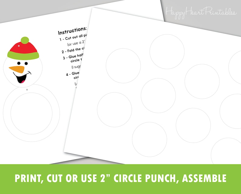 May include: Printable snowman craft kit with instructions. The kit includes a snowman face with a red and green hat, and a series of white circles. The text at the bottom reads: PRINT, CUT OR USE 2" CIRCLE PUNCH, ASSEMBLE.