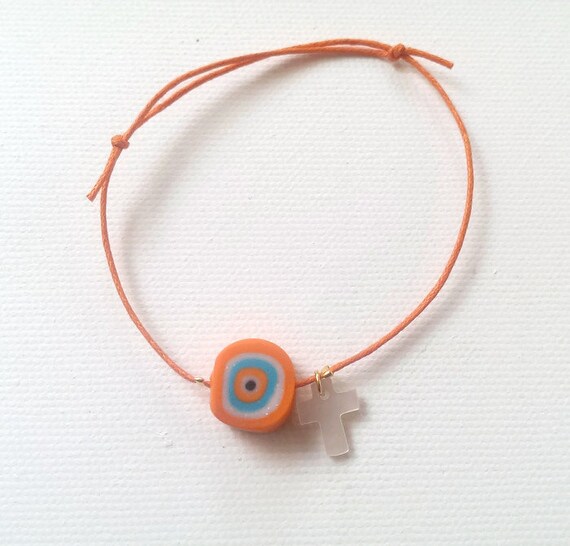 Orange bracelet with evil eye and shell cross baptism gift Etsy
