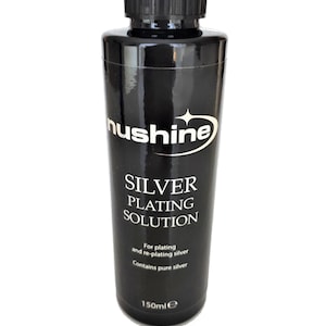 Op de afbeelding: Een zwarte fles met zilveren plating oplossing met de merknaam "hushine" en de tekst "SILVER PLATING SOLUTION" op het etiket. De fles bevat 150 ml oplossing en is geschikt voor het platen en opnieuw platen van zilver.