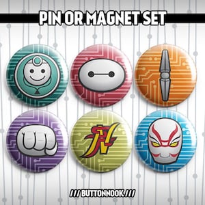 May include: Set of six 1-inch round pinback buttons featuring various cartoon characters. The buttons are colorful and have a circuit board design. The characters include Baymax, a robot with a white face, a robot with a blue face, a red and yellow character, a white character with a red mask, and a character with a blue and white mask.