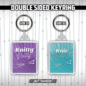 May include: Double-sided acrylic keychain with a purple and blue background. One side says "Knitty Gritty" with a pair of knitting needles. The other side says "Knit Happens" with a pair of knitting needles.