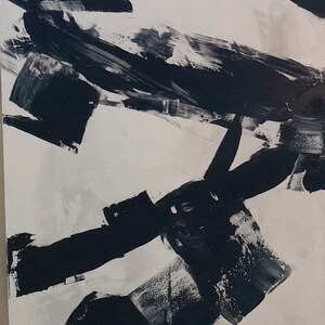 May include: Abstract black and white painting with bold brushstrokes on a white background.