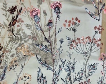 May include: Beige sheer fabric with embroidered floral designs in shades of pink, blue, and gold. The flowers are scattered across the fabric and have a delicate, vintage look.
