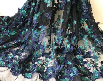 May include: Black mesh fabric with green and blue embroidered butterfly designs.