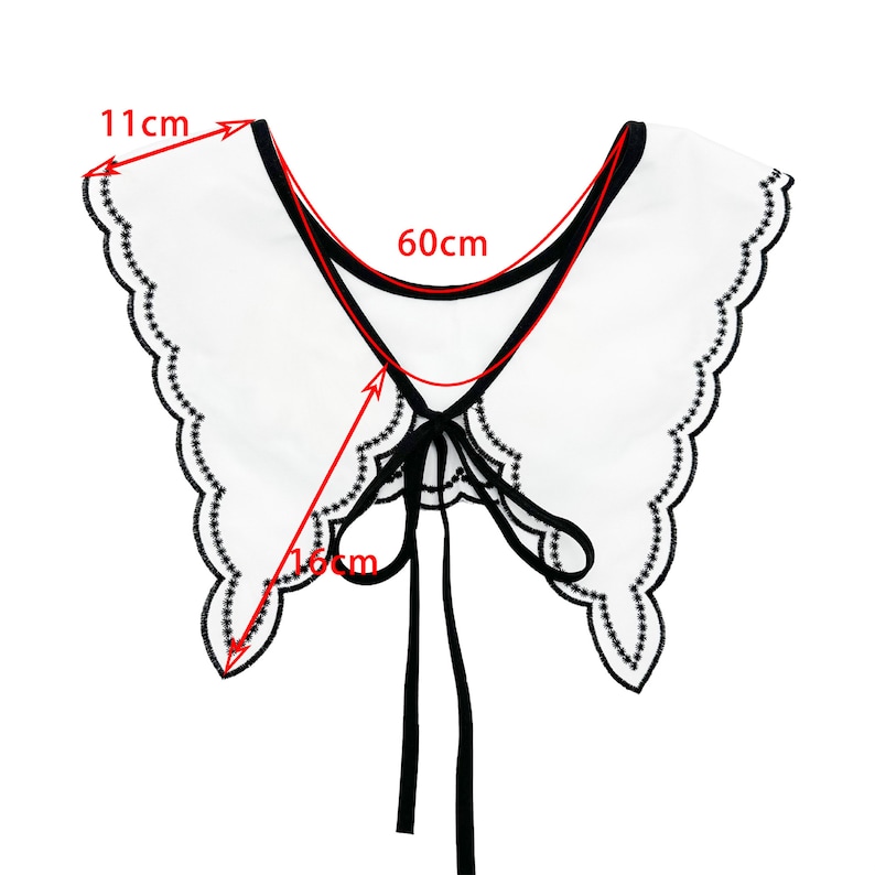 May include: White faux collar with black trim and a scalloped edge. The collar has a black ribbon tie and measures 11 inches wide and 16 inches long.