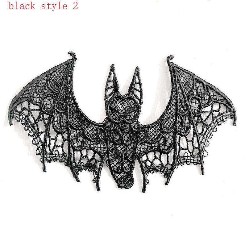 May include: A black lace bat with detailed openwork wings. The bat design is intricate and delicate. The text "black style 2" is in the upper left corner. This is a decorative item.