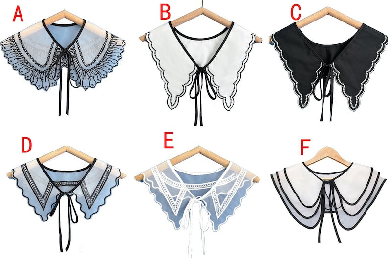 May include: Six different styles of faux collar necklaces, each with a different lace pattern and color. The collars are all white, black, or blue and have black ribbon ties.