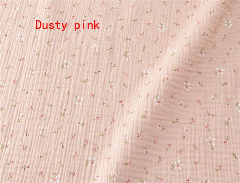 May include: Dusty pink fabric with a small white floral pattern.
