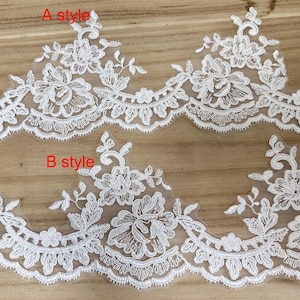 May include: Close-up of two styles of white floral lace trim. The lace features detailed floral and leaf patterns with scalloped edges. The text "A style" and "B style" are visible on the image.