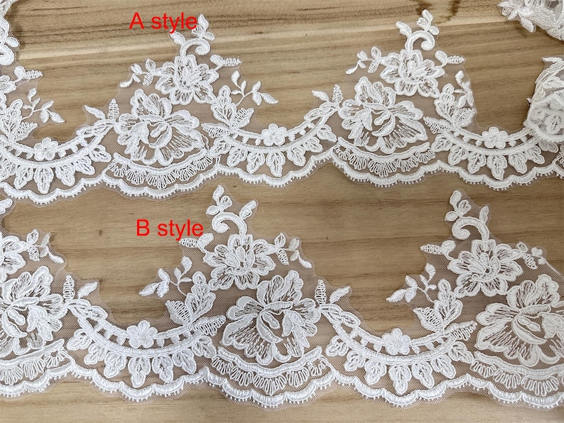 May include: Close-up of two styles of white floral lace trim. The lace features detailed floral and leaf patterns with scalloped edges. The text "A style" and "B style" are visible on the image.