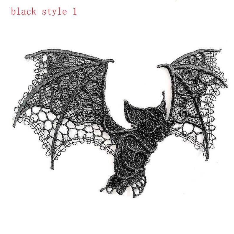 May include: A black lace bat applique with detailed wings and body. The text "black style 1" is in the upper left corner. Ideal for adding a gothic touch to clothing or craft projects. The lace has a delicate, open weave.