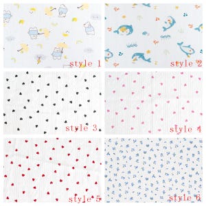 May include: A collection of six fabric swatches featuring various patterns on a white background. Style 1 shows bears with umbrellas, style 2 shows dolphins, style 3 has black hearts, style 4 has pink hearts, style 5 has red hearts, and style 6 has blue flowers.