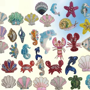May include: A collection of assorted ocean-themed patches crafted with colorful beads and sequins. The set includes various designs such as seashells, seahorses, starfish, crabs, a lobster, a dolphin, a snail, and fish in diverse vibrant colors.