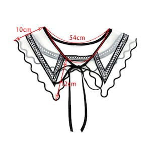 May include: A white sheer lace collar with black lace trim and a black ribbon tie. The collar measures 54 cm in length and 10 cm in width. The ribbon tie is 12 cm long.
