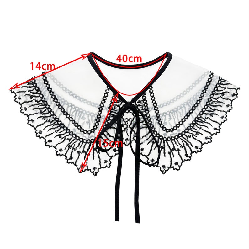 May include: White lace collar with black embroidery and a black ribbon tie. The collar measures 14 inches wide and 40 inches long.