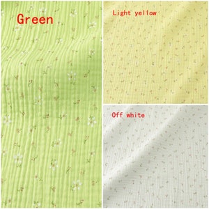 May include: Three fabric swatches with a small floral pattern. The swatches are green, light yellow, and off white.
