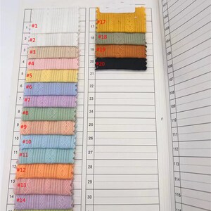 May include: A swatch book of fabric samples with different colors and textures. The swatches are numbered from 1 to 20. The fabric samples are all ribbed.