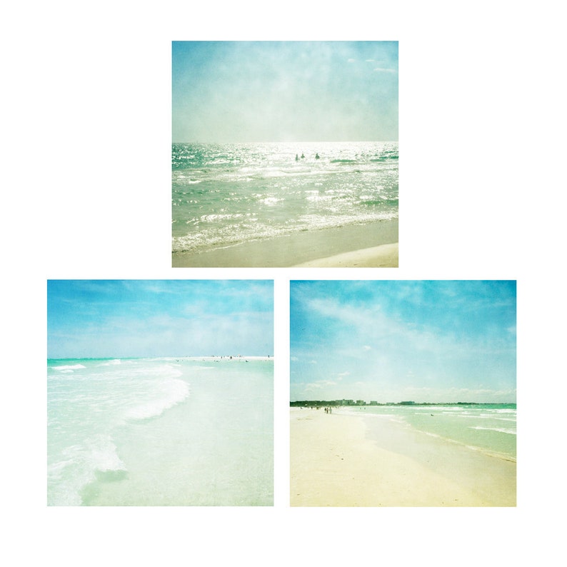 May include: Three photos of a beach with blue skies and white sand. The first photo shows the ocean with waves crashing on the shore. The second photo shows a wide view of the beach with the ocean in the background. The third photo shows a closer view of the beach with the ocean in the background.