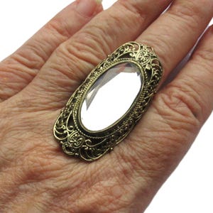 Victorian Style Oval Rhinestone Ring with Elegant Filigree Gold Tone Border
