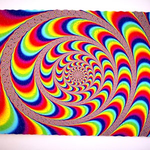 May include: A colorful jigsaw puzzle with a swirling, hypnotic pattern of rainbow colors. The puzzle pieces are arranged in a spiral shape, creating an optical illusion.