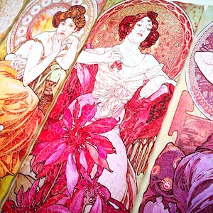 May include: Four vintage art nouveau style jigsaw puzzle pieces featuring women in elaborate dresses and floral designs. The pieces are in shades of pink, red, orange, and yellow.