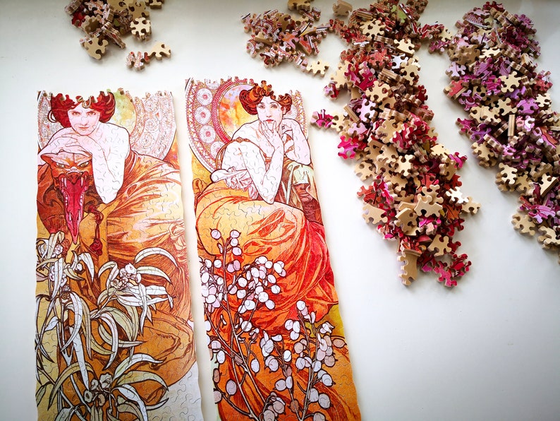 May include: Two framed art prints with a vintage aesthetic. The prints feature women in flowing orange and red dresses with floral details. The prints are surrounded by a white background.