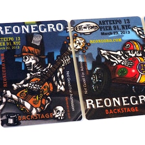 May include: Four black and white backstage passes for the ArtExpo 13 at Pier 91 in NYC. Each pass features a different skeleton illustration with the text "Reonegro" and "Backstage".