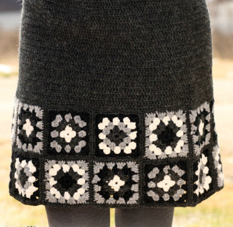 May include: A gray crochet skirt with a black, white, and gray granny square trim.
