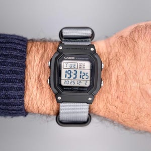 Modified Casio W800H digital watch: "Nightstone" – duotone violet/turquoise backlight gradient, Timer function unlocked