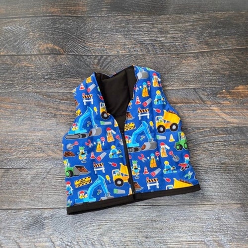 Construction site, dump trucks weighted vest. For sensory, anxiety