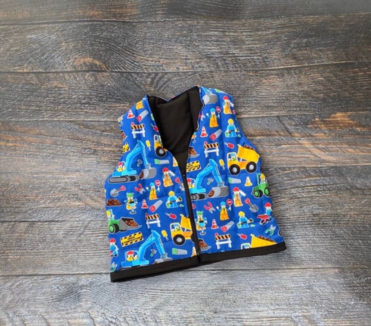 Construction site, dump trucks weighted vest. For sensory, anxiety