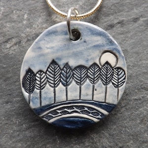 Handmade Ceramic Moonlit Trees pendant in blue, tree lover gift