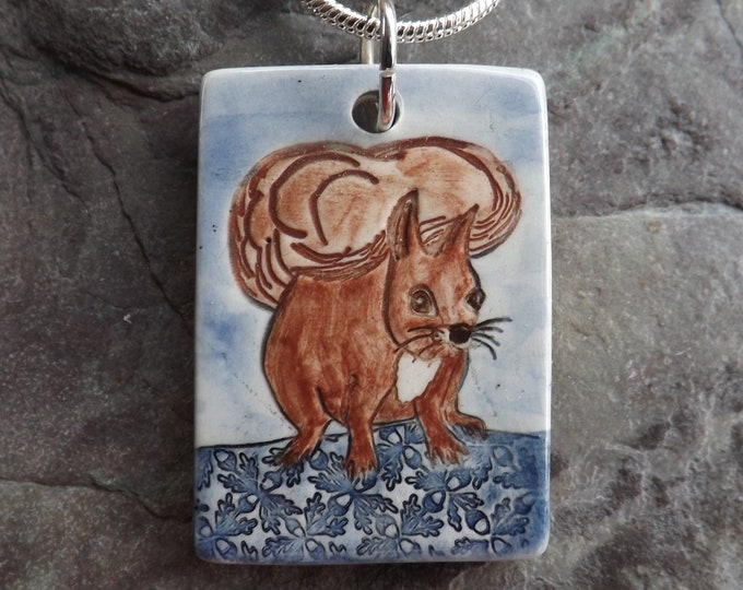 Ceramic Red Squirrel pendant in blue