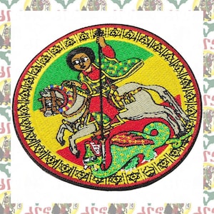 May include: A circular embroidered patch featuring a figure on a white horse holding a long spear, piercing a green dragon. The background is divided into green, yellow, and red sections, surrounded by a black border with a repeating gold pattern.