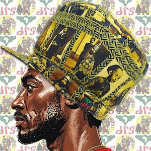 May include: A yellow and black patterned cap with a flat brim. The cap features a collage of sepia-toned images and geometric designs. The background is a repeating pattern of a lion and the African continent. The cap has a small green and red tag with the letters "SJP".