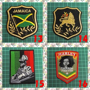 May include: Four embroidered patches with a green, black, and red color scheme. The patches feature a Jamaican flag, a lion with a crown, a soldier in a military uniform, and a portrait of Bob Marley with the text "Marley Freedom Fighter".