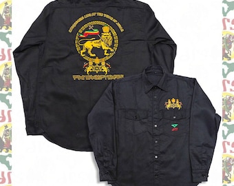 May include: Black long-sleeve button-down shirt with gold embroidery of a lion and the text "Conquering Lion of the Tribe of Judah" on the back. The front of the shirt has a smaller gold embroidery of a lion and crown.