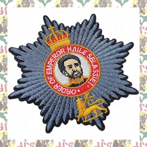 May include: Embroidered patch featuring a blue starburst design with a central medallion. The medallion displays a portrait and the text "ORDER OF EMPEROR HAILE SELASSIE". A gold lion and crown are also present.