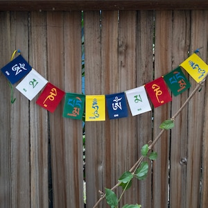 Smallest cloths, mini prayer flags for meditation, spiritual home décor, yoga room decorations, and mindfulness-focused gift ideas.