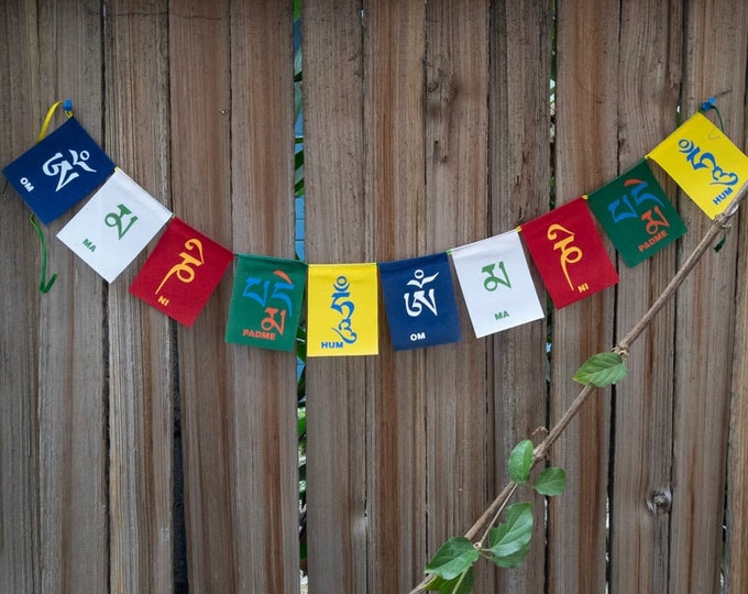 Small Buddhist prayer flags or mini-size cloth prayer flags for meditation, spiritual home décor, yoga room decorations, or gift ideas.