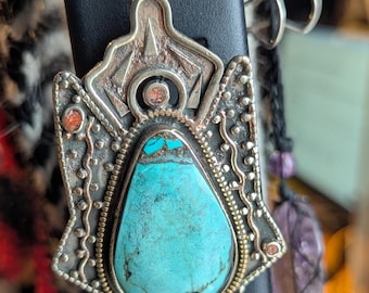 Tibetan antique ethnic pendant adorned with turquoise and coral inlays. (p6-002)