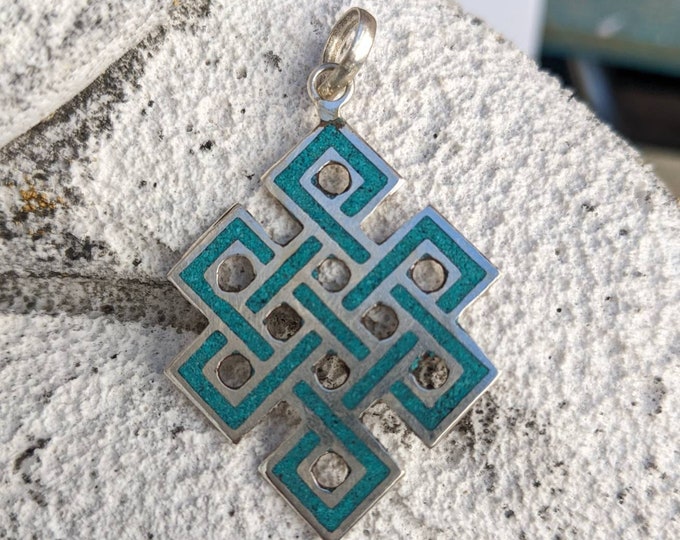 Turquois compassion knots, endless knots Buddhist knots