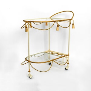 Very rare italian Mid Century Modern Bar Cart made of metal in beige and gold with glass elements