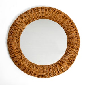 Very beautiful 1960s Italian round wall mirror with a wide wickerwork and bamboo frame