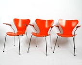 Three original Arne Jacobsen armchairs in orange Mod. 3207 of 1982