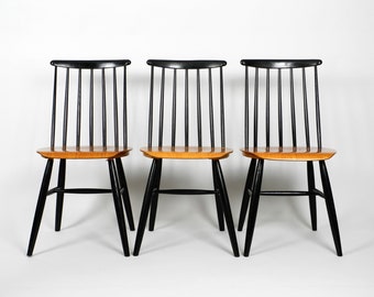 Set of three original Mid Century wood spindle back chairs with teak seat in the style of Ilmari Tapiovaara