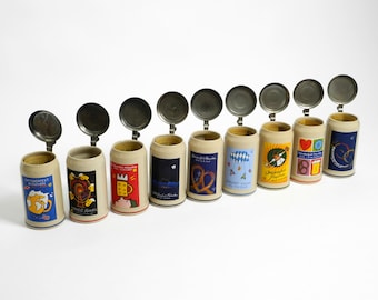 Neuf chopes à bière originales inutilisées de l'Oktoberfest de Munich avec couvercles en étain lourd de 2001, 2002, 2003, 2004, 2005, 2006, 2007, 2008, 2009