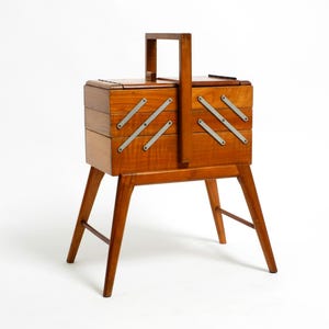 Beautiful original Italian Mid Century Modern sewing box made of walnut wood with fold-out compartments