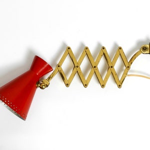Original Mid Century brass extendable scissor wall lamp with aluminum diabolo shade in red and brass