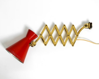 Original Mid Century brass extendable scissor wall lamp with aluminum diabolo shade in red and brass
